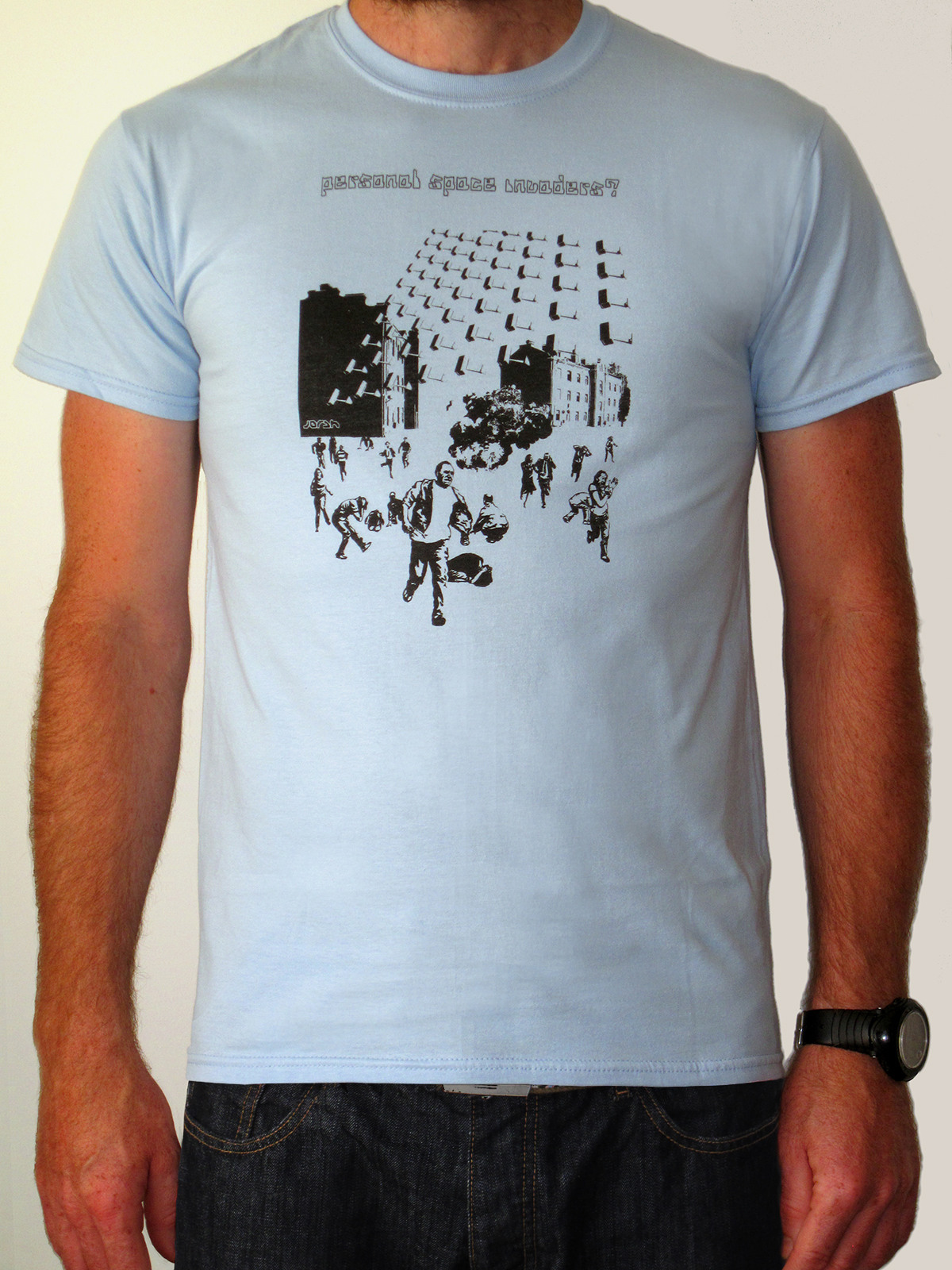 t-shirt with CCTV cameras coming out the sky in space invaders formation. Explosion, people running scared
